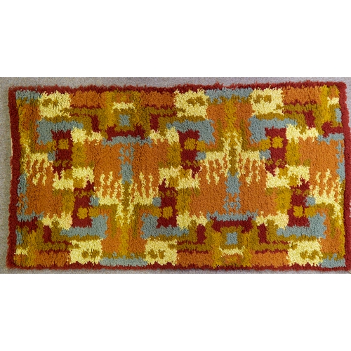 2105 - A mid-century shag pile rug, with abstract design, 130cm x 70cm.