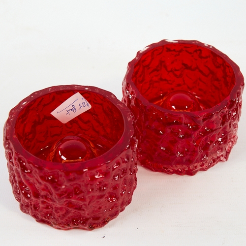 2117 - GEOFFREY BAXTER FOR WHITEFRIARS, a pair of mid century ruby glass candle holders, diameter 8cm.