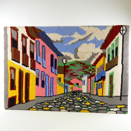 2124 - A mid-century punch needle embroidery, street scene, 60cm x 83cm, unframed on board.