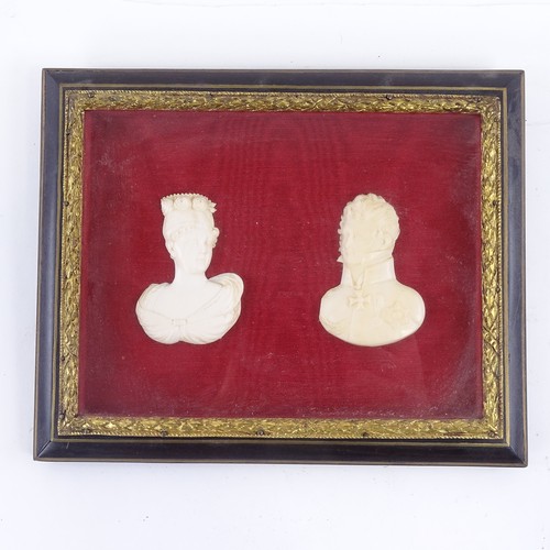 66 - ROYAL INTEREST - a pair of 19th century relief carved ivory portrait busts of Princess Charlotte and... 