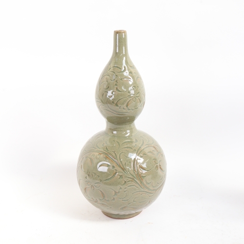 65 - A Chinese celadon crackle glaze double-gourd vase, with incised floral decoration, height 33cm