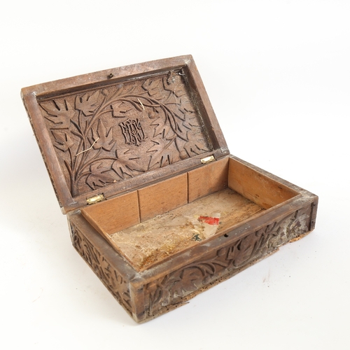 67 - An Eastern carved hardwood Royal Artillery box, with high relief carved insignia lid and original ca... 