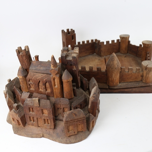 104 - A carved and stained wood hilltop town and castle display, possibly of St Michael's Mount, base leng... 