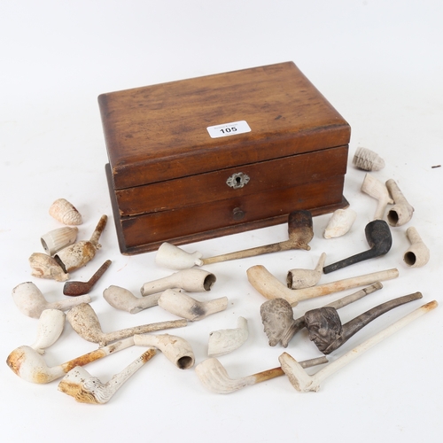 105 - A group of 19th century clay pipes, including figural and Rye examples, in stained pine storage box,... 