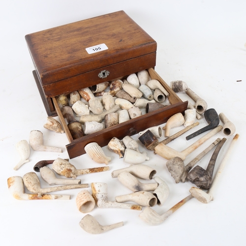 105 - A group of 19th century clay pipes, including figural and Rye examples, in stained pine storage box,... 