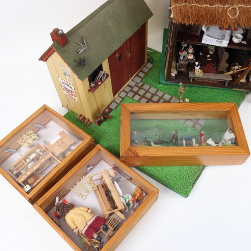 111 - A handmade thatched doll's house, a model outhouse, and 3 diorama cabinet scenes (5)