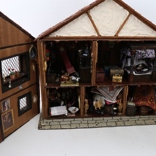 114 - A handmade model doll's house diorama, with many fixtures and fittings, H42cm, W47cm