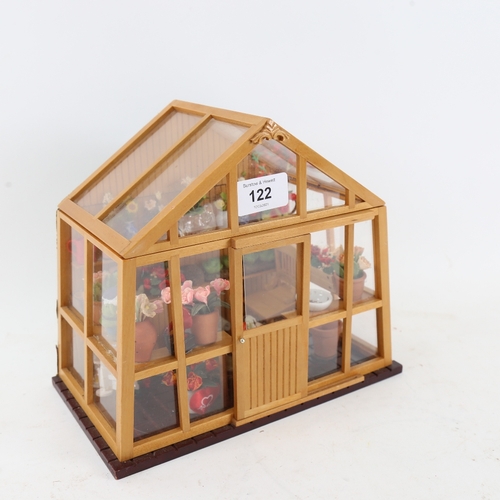 122 - A small doll's house greenhouse with flowers and fittings, W23cm, H20cm, D13cm