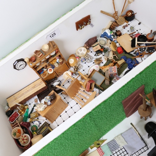 125 - A handmade doll's house kitchen diorama interior scene, with many fixtures and fittings, W46cm, H14c... 