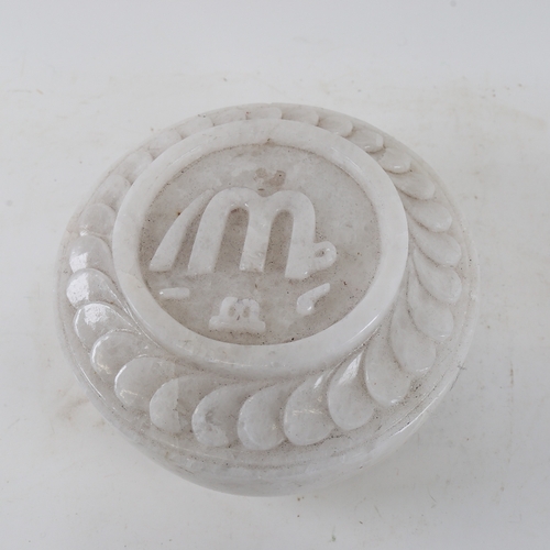 130 - A heavy solid white marble/alabaster disc shaped carving, carved on both sides, diameter 25cm, cased