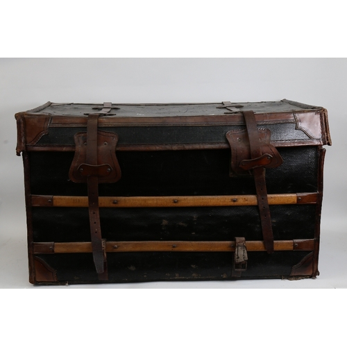 139 - A large early 20th century leather and wood-bound wicker travelling steamer trunk, with cloth lining... 