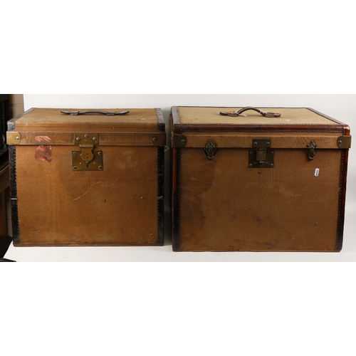 140 - A graduated pair of early 20th century French canvas and metal-bound board travelling trunks, and 2 ... 