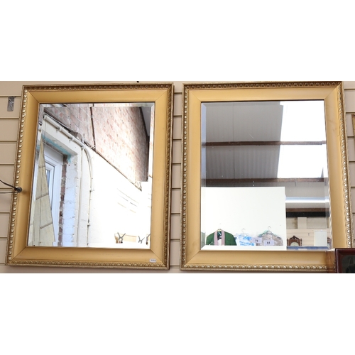 79 - A modern pair of rectangular gilt-framed bevelled-edge wall mirrors, 74cm x 64cm