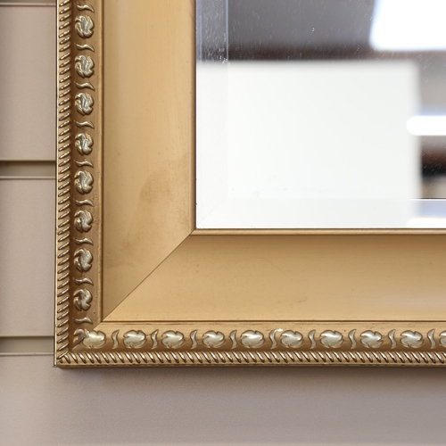 79 - A modern pair of rectangular gilt-framed bevelled-edge wall mirrors, 74cm x 64cm