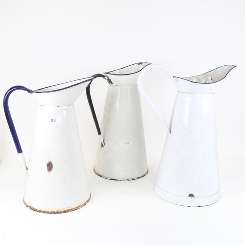 83 - 3 large blue and white enamel water jugs, largest height 36cm (3)