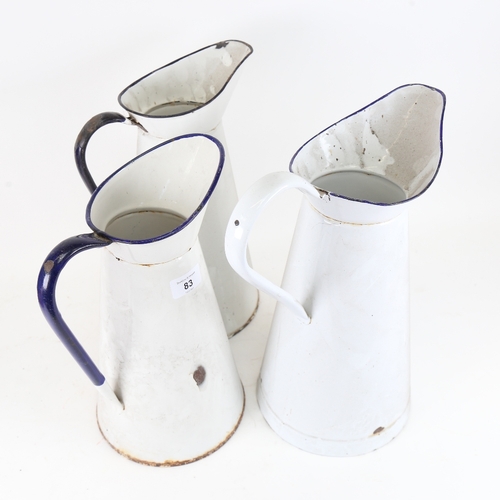 83 - 3 large blue and white enamel water jugs, largest height 36cm (3)