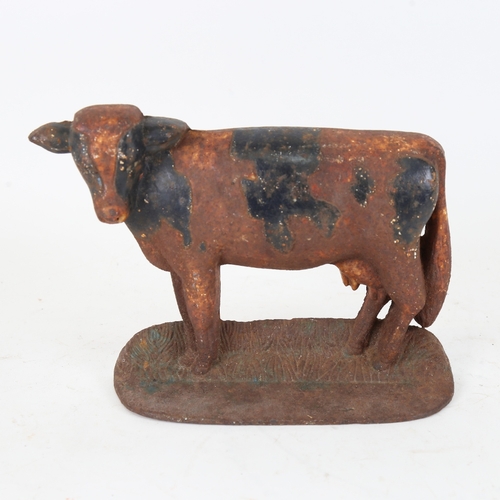 87 - A Vintage painted cast-iron cow doorstop, height 16cm, length 22cm