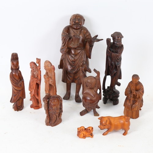 192 - Various Oriental carved wood figures, including pig netsuke, Japanese musician, Shou Lao, largest he... 