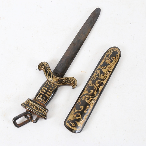 194 - A small Chinese carved and gilded black stone dagger and sheath, blade length 15.5cm (blade broken a... 