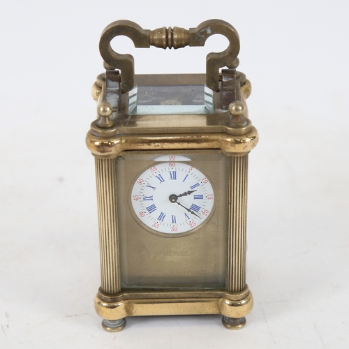 197 - A modern brass-cased miniature carriage clock, bevelled glass exhibition viewing plates, case height... 