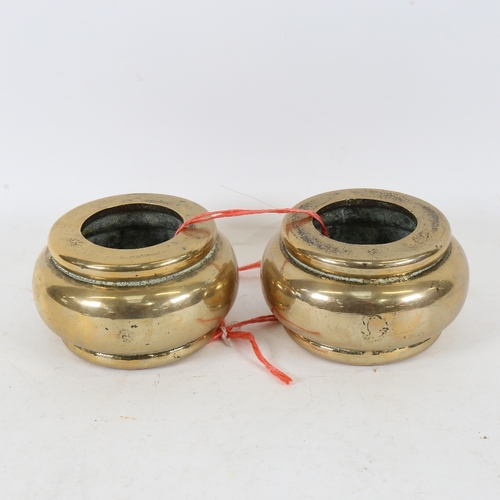 203 - A heavy pair of Chinese bronze weights/slave bangles, overall diameter 12cm (2)