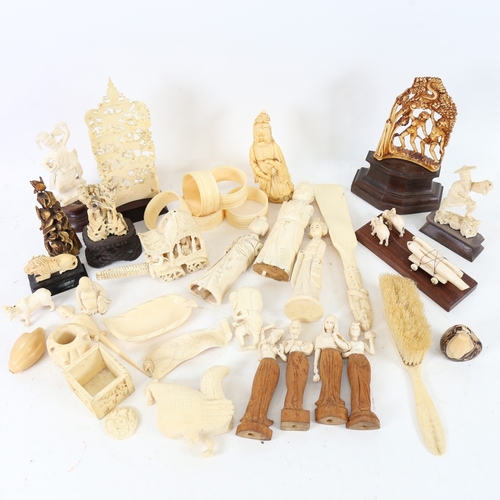 217 - A quantity of various ivory and bone carvings, including lion mask napkin ring, Japanese okimono, Eg... 