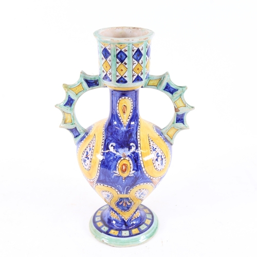 233 - An Italian Majolica pottery 2-handled pedestal vase, blue and yellow painted decoration with spiked ... 