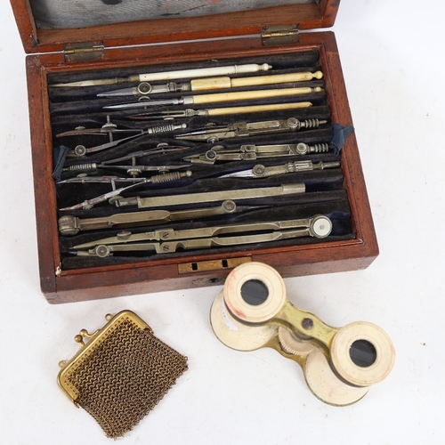 258 - An early 20th century drafting set, bone-mounted opera glasses, and a gilt-metal evening purse (3)