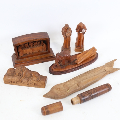 261 - Various carved wood items, including 19th century oak needle case, Lucerne lion, elephant dragging a... 