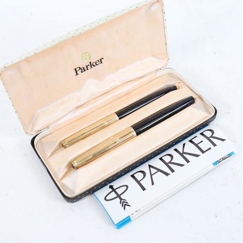 287 - A Parker 51 black lacquered and gold plated fountain and ballpoint pen set, boxed