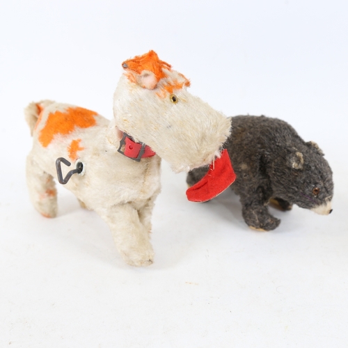 291 - An early 20th century Alps mechanical clockwork playful puppy dog toy, and a similar Vintage Alps cl... 