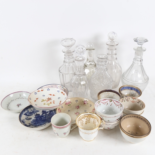 306 - 6 glass decanters with 5 stoppers, and various 19th century tea bowls and non-matching saucers, some... 