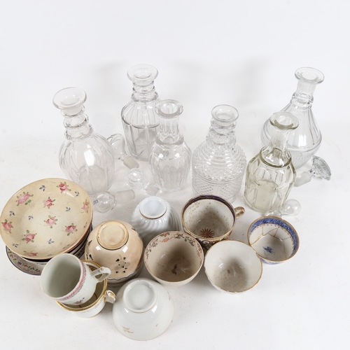 306 - 6 glass decanters with 5 stoppers, and various 19th century tea bowls and non-matching saucers, some... 