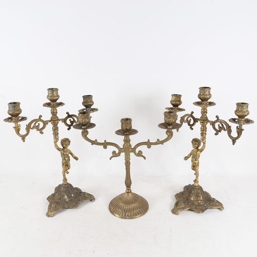 309 - A pair of gilt metal figural 2-branch candlesticks and another, height 35cm (3)