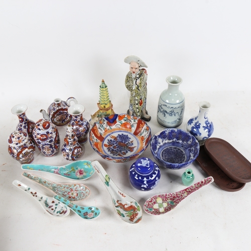 318 - A group of various Oriental ceramics, including small Imari pattern vases, porcelain spoons, figure ... 