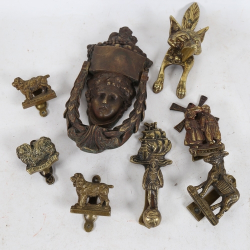 319 - Various brass door knockers (8)