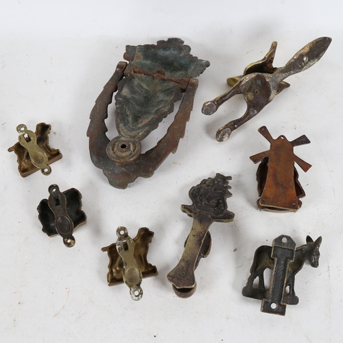 319 - Various brass door knockers (8)