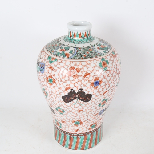 333 - An Oriental baluster vase with butterfly decoration and 6 character mark on base, height 30cm