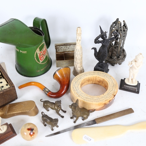 335 - A box of miscellaneous items, to include a silver-mounted pipe in case, a Castrol Oil tin, miniature... 