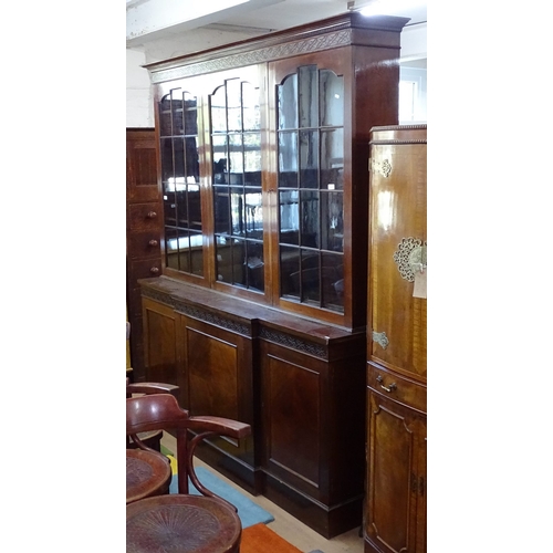 1847 - A mahogany 2-section library bookcase, in Chippendale style, having 3 arched lattice-glazed doors, o... 