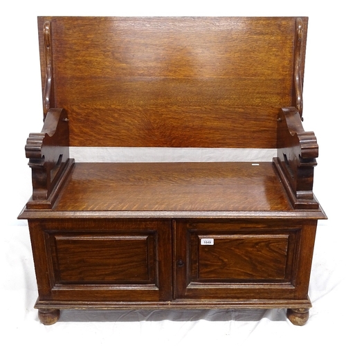 1849 - An oak monk's bench with cupboard base, W90cm, H66cm, D38cm