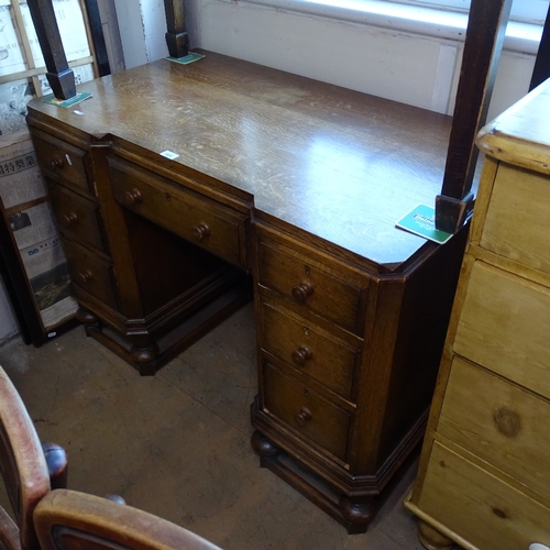 1851 - An Edwardian oak pedestal writing desk with fitted drawers, W107cm, H78cm, D63cm, kneehole width 38c... 