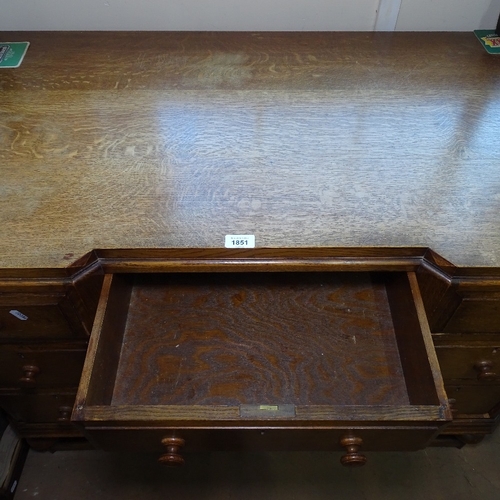 1851 - An Edwardian oak pedestal writing desk with fitted drawers, W107cm, H78cm, D63cm, kneehole width 38c... 