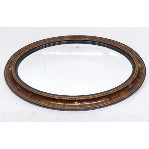 1866 - An Edwardian oval bevelled-edge wall mirror, with original paint finish