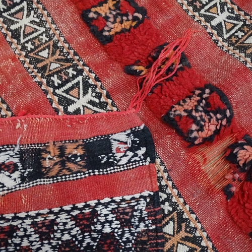 1875 - A red ground Kilim rug, 200cm x 90cm