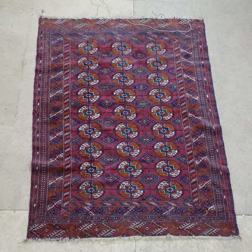 1878 - A red ground Afghan Tekki carpet, with symmetrical pattern, 146cm x 106cm