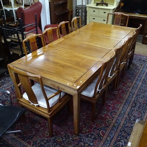 1906 - A Chinese design 3-piece dining room suite, comprising a rectangular dining table with 2 spare leave... 