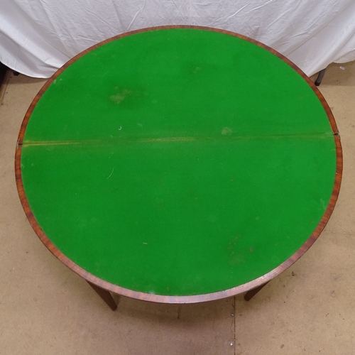 1912 - A 19th century mahogany demilune fold over card table, on square tapered legs