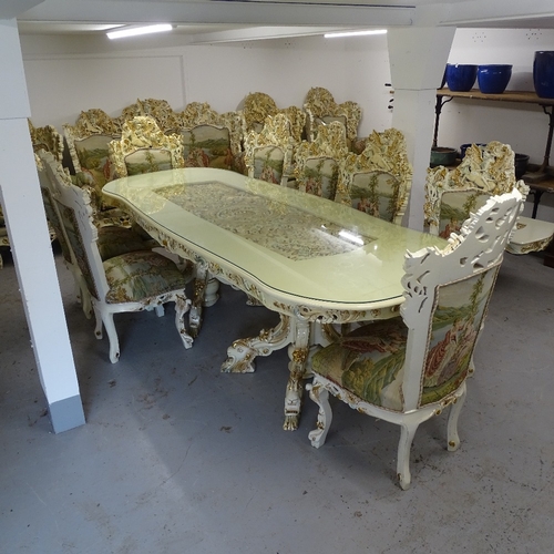 2198 - A bespoke made dining room suite, comprising a large serpentine-shape table, with an inset carved an... 