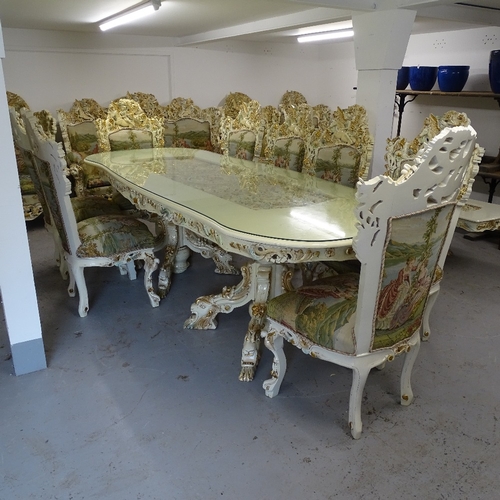 2198 - A bespoke made dining room suite, comprising a large serpentine-shape table, with an inset carved an... 